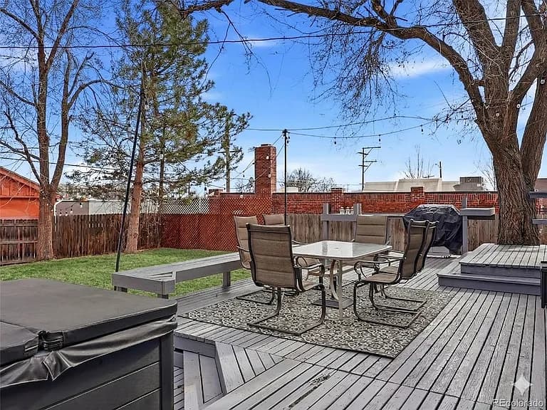 Deck with patio dining area and hot tub